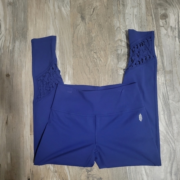 Free People Movement cropped leggings size medium with bottom cut out details - Picture 1 of 13